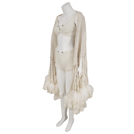 RIHANNA  Vintage bathing suit and feathered shawl worn in “Only Girl (In The World)”