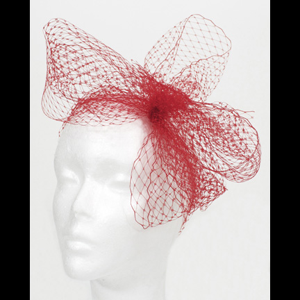 RIHANNA  Red mesh headpiece worn in video for “What’s My Name?”